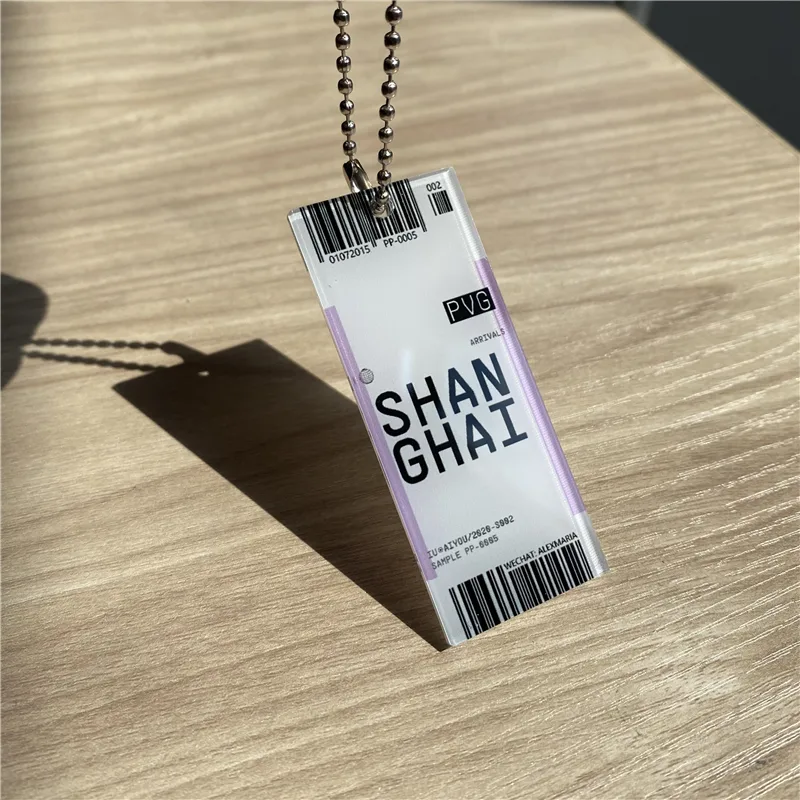 Rectangular acrylic keychain printed with a Shanghai luggage-tag design, on a ball chain