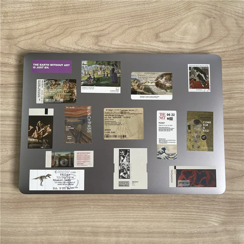 Metal board covered with museum-ticket fridge magnets of different sizes